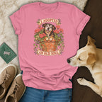 A pink t-shirt featuring a graphic of an older dog in a flower pot with the text I Adopted An Old Soul.
