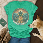 All Paws on Deck graphic on a green t-shirt with a dog and nautical scene.