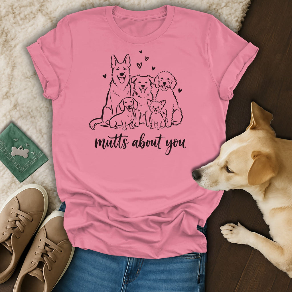 Pink t-shirt with black line drawing of five dogs and "mutts about you" text.
