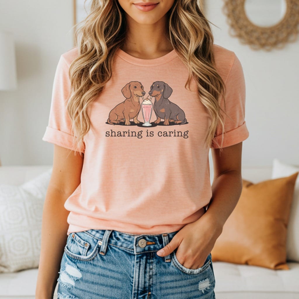 Two dachshunds share a milkshake, with text "sharing is caring" below.