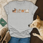 Grey t-shirt with cartoon dogs dressed as witch, mummy, pumpkin, and ghost.
