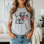 Dog wearing bandana and holding American flag with "America's 250th anniversary" text.