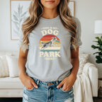 Grey t-shirt with vintage design of a dog catching a frisbee.