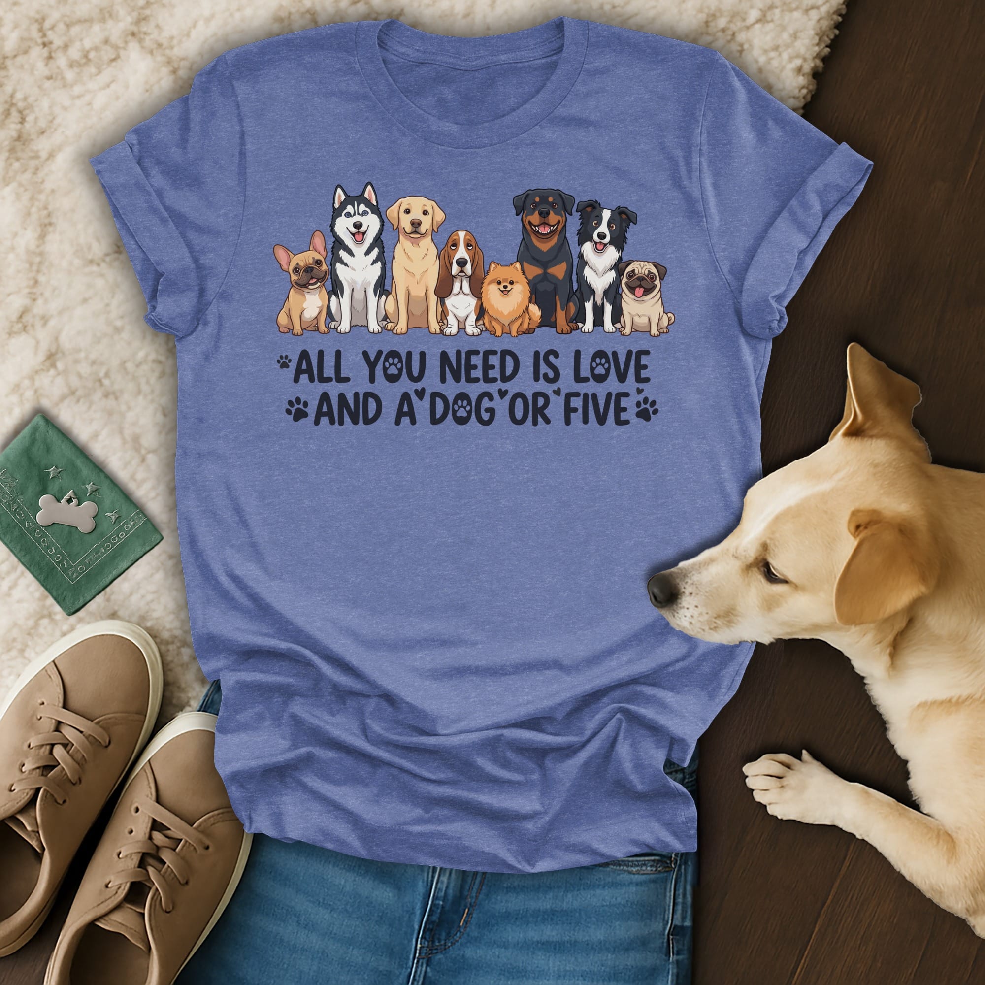 T-shirt with illustration of various dog breeds and the text "All you need is love and a dog".