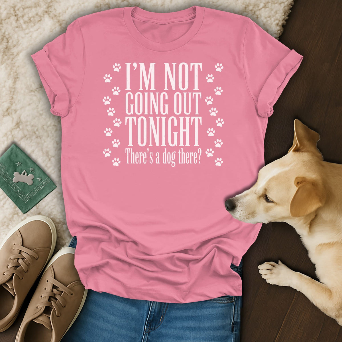 Pink t-shirt with white text: "I'M NOT GOING OUT TONIGHT There's a dog there?"