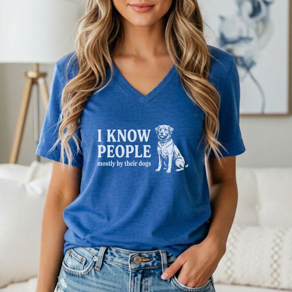 Blue V-neck t-shirt with white graphic: "I KNOW PEOPLE mostly by their dogs" and a dog illustration.