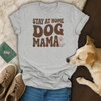 Grey t-shirt with brown text "STAY AT HOME DOG MAMA" and a dog illustration.