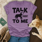 Purple t-shirt with "TALK TO ME HUSKY" text and a howling husky graphic.