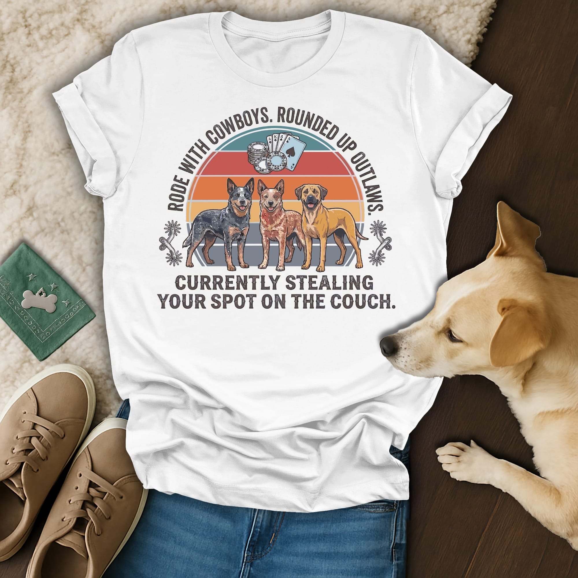 White t-shirt with three dogs and text about stealing spots on the couch.