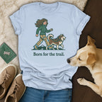 Light blue t-shirt with woman and husky walking, "Born for the trail."
