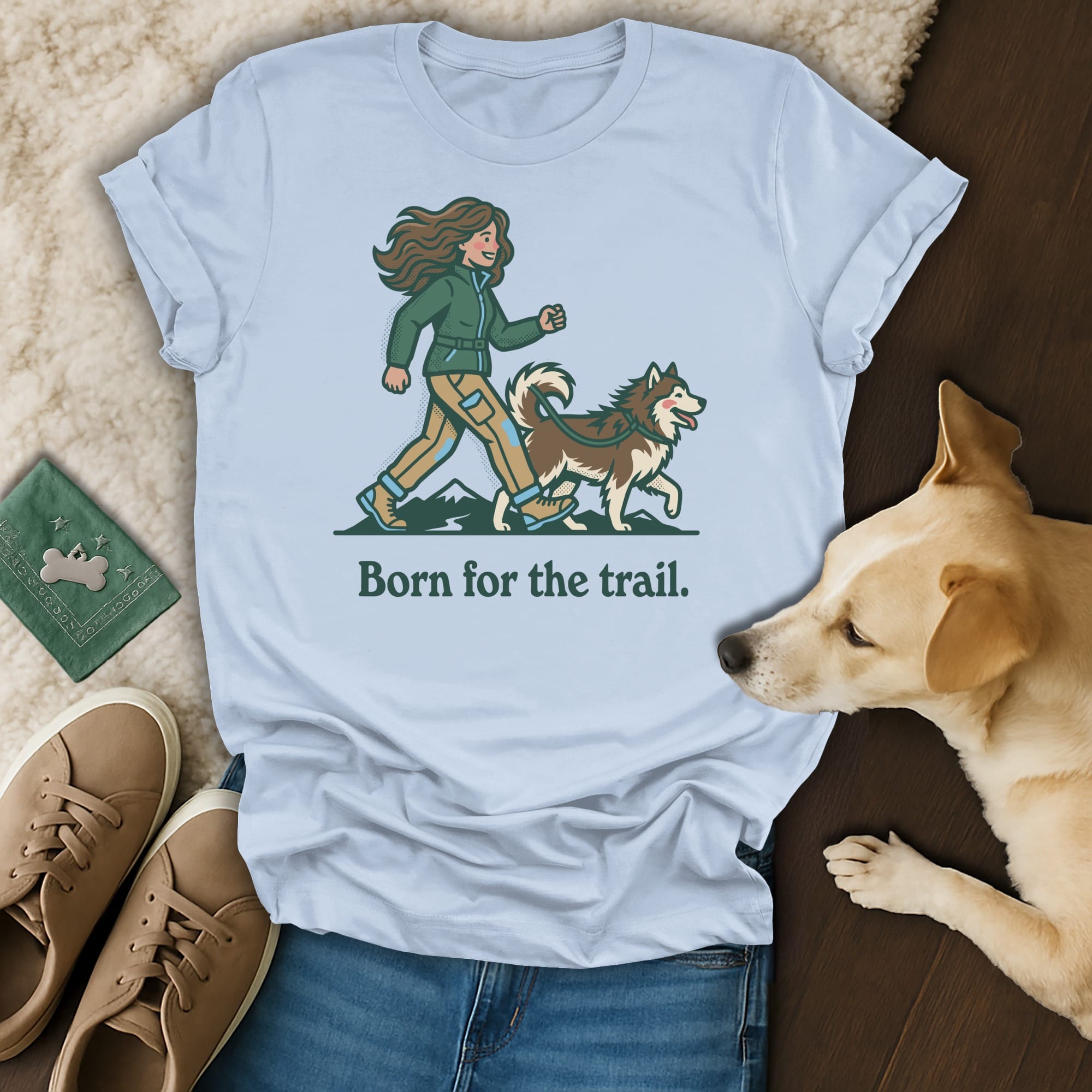 Light blue t-shirt with woman and husky walking, "Born for the trail."