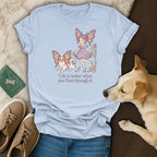T-shirt with a girl and dog wearing butterfly wings, with text "Life is better when you float through it."