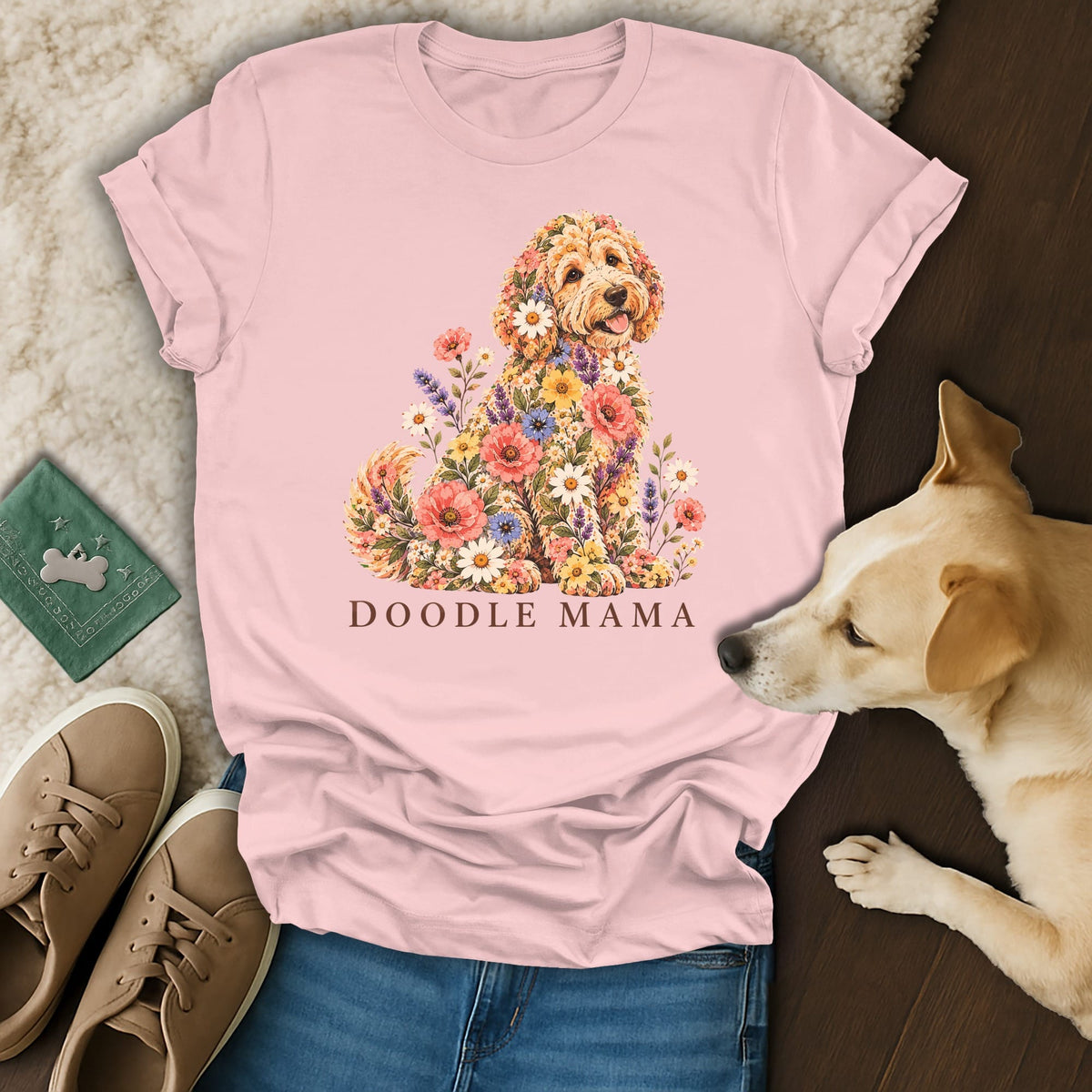 A light pink t-shirt featuring a floral Doodle dog graphic with the text DOODLE MAMA.