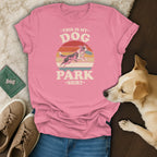 Pink t-shirt with retro graphic: "This Is My Dog Park Shirt" and running dog catching frisbee.