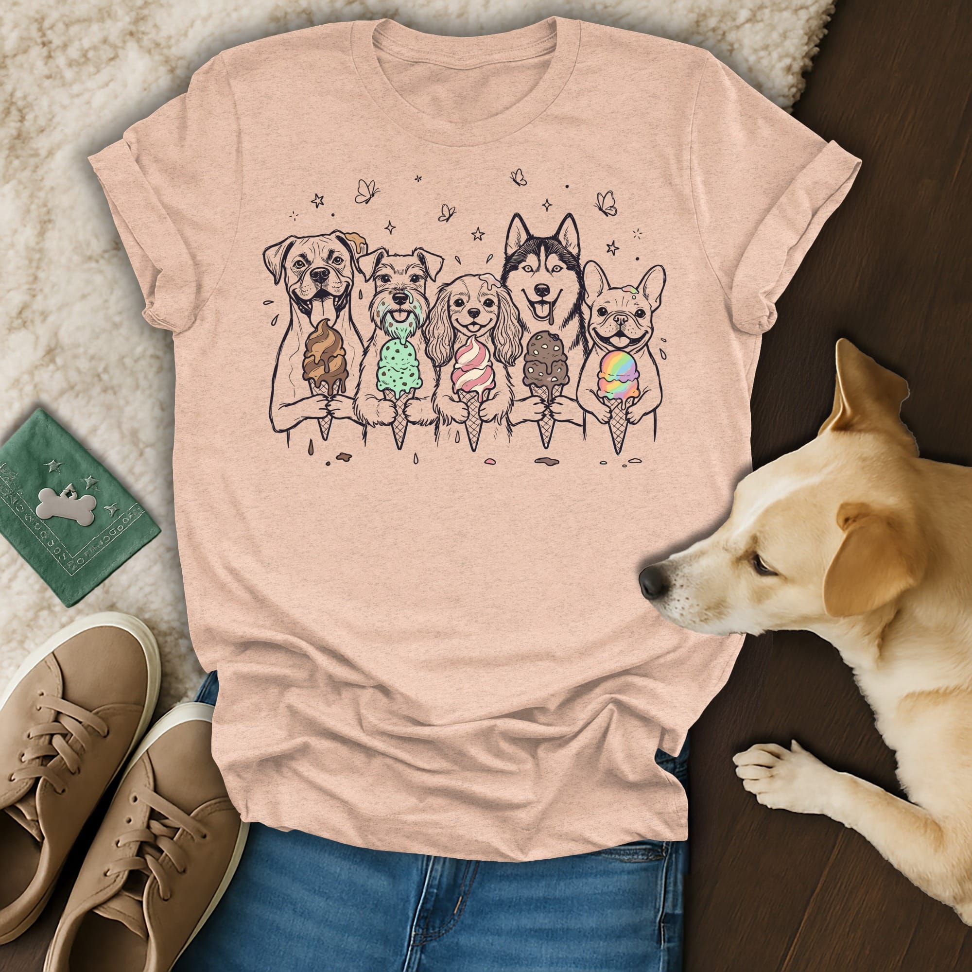 T-shirt with cartoon dogs holding ice cream cones, a dog lying beside it.
