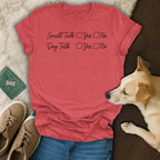 Red t-shirt with "Small Talk" and "Dog Talk" checklist text and dog nearby.
