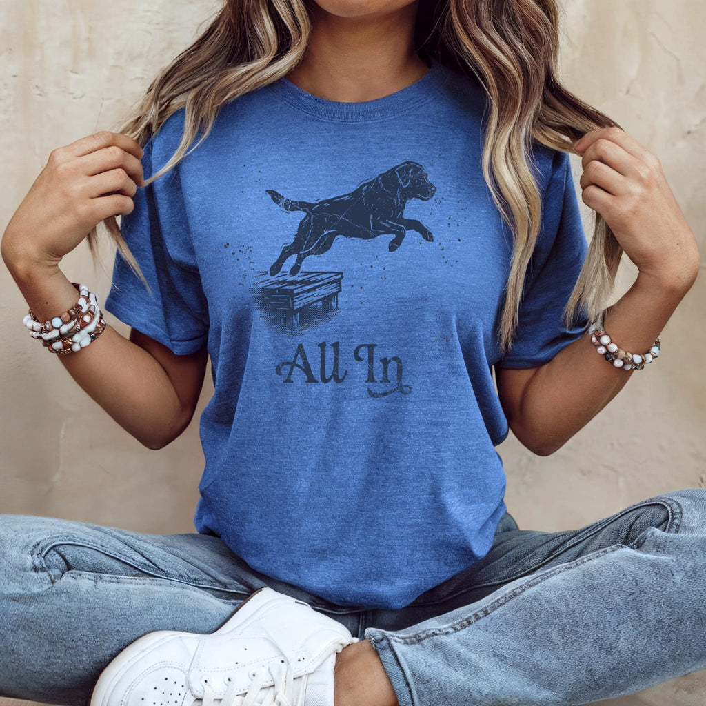 Blue t-shirt with black dog jumping over obstacle, "All In" text.