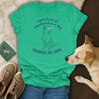 Green t-shirt with a sketch of a dog wearing sunglasses and text about ignoring its name.