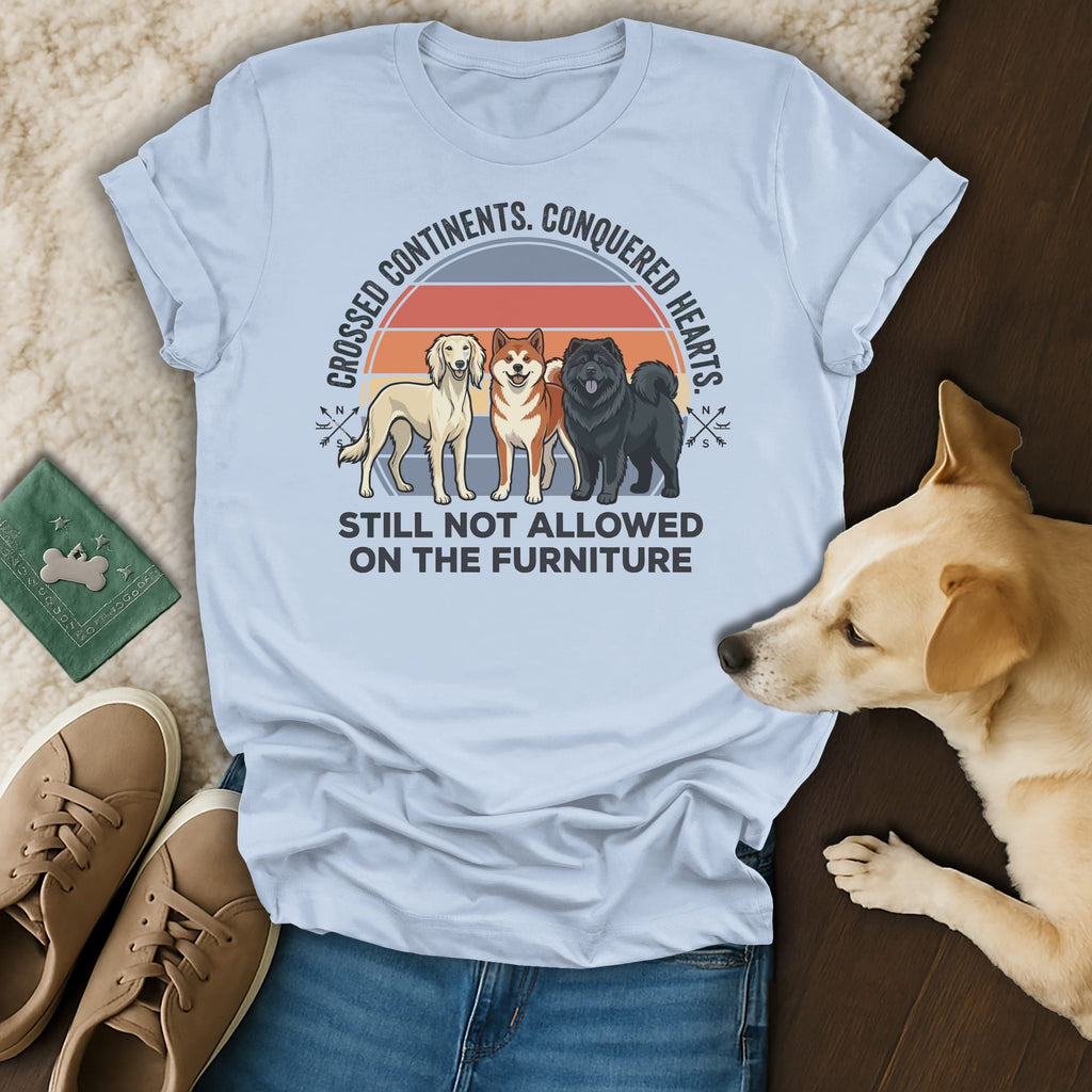 T-shirt with dogs and text "Crossed Continents. Conquered Hearts. Still Not Allowed on the Furniture."