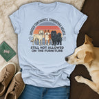 T-shirt with dogs and text "Crossed Continents. Conquered Hearts. Still Not Allowed on the Furniture."