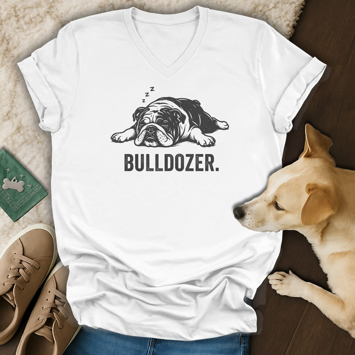 White v-neck t-shirt with a sleeping bulldog graphic and the text BULLDOZER.