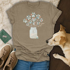 T-shirt with a mason jar bouquet of colorful paw prints and seashells.