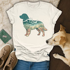 T-shirt with a dog silhouette filled with a beach scene and waves.