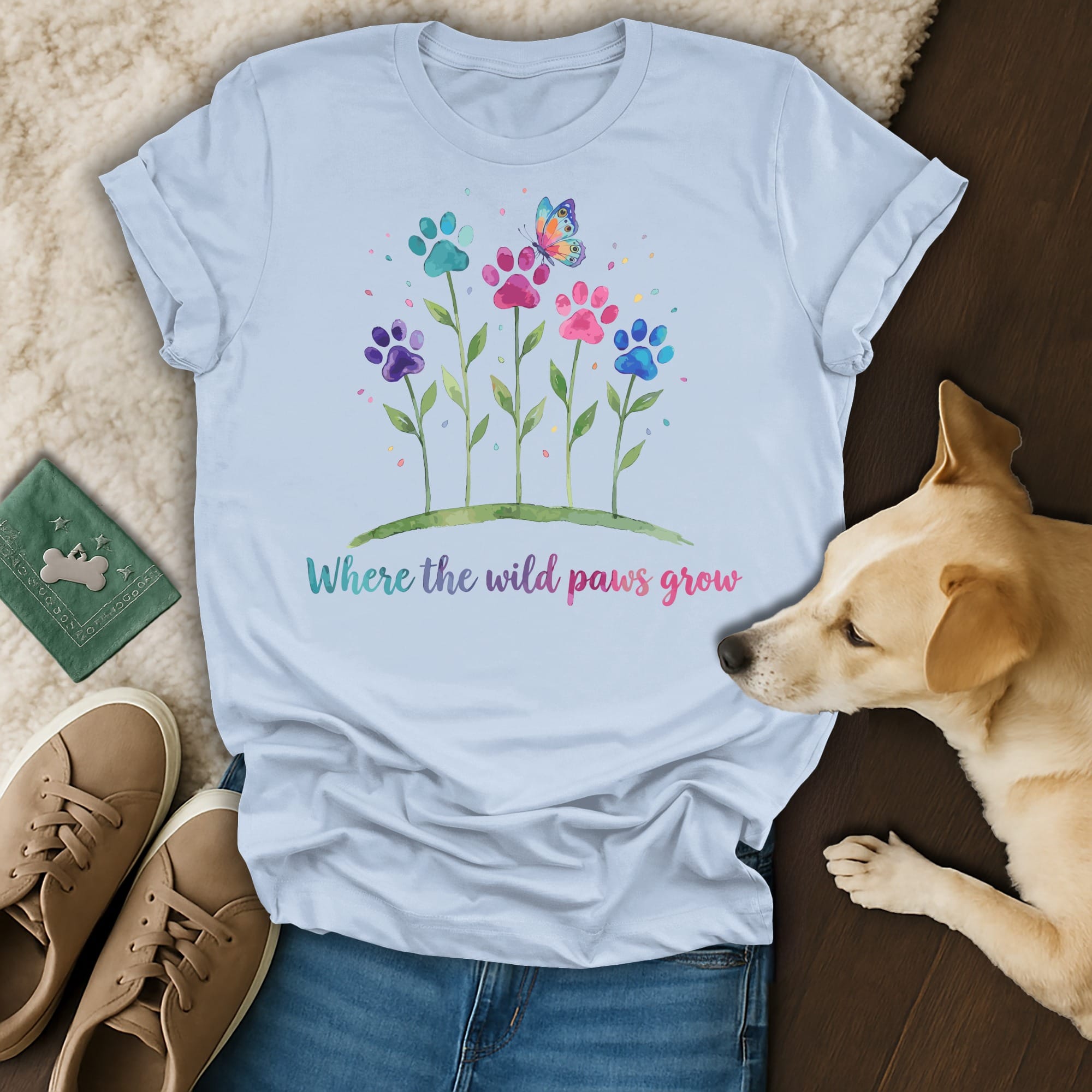 T-shirt with watercolor paw prints and butterfly, "Where the wild paws grow."