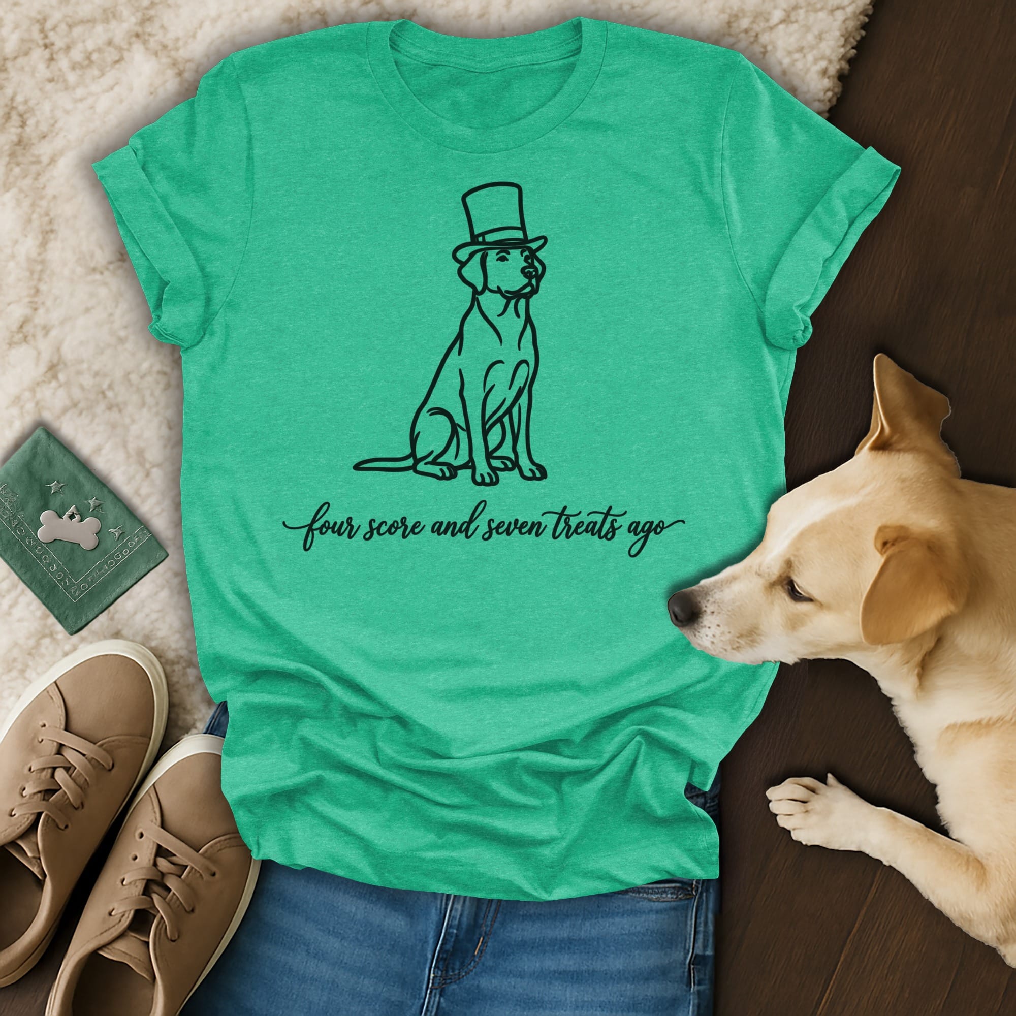 Dog wearing top hat with "four score and seven treats ago" text on a t-shirt.