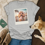 Grey t-shirt with a polaroid-style print of a dog wearing heart sunglasses eating ice cream.