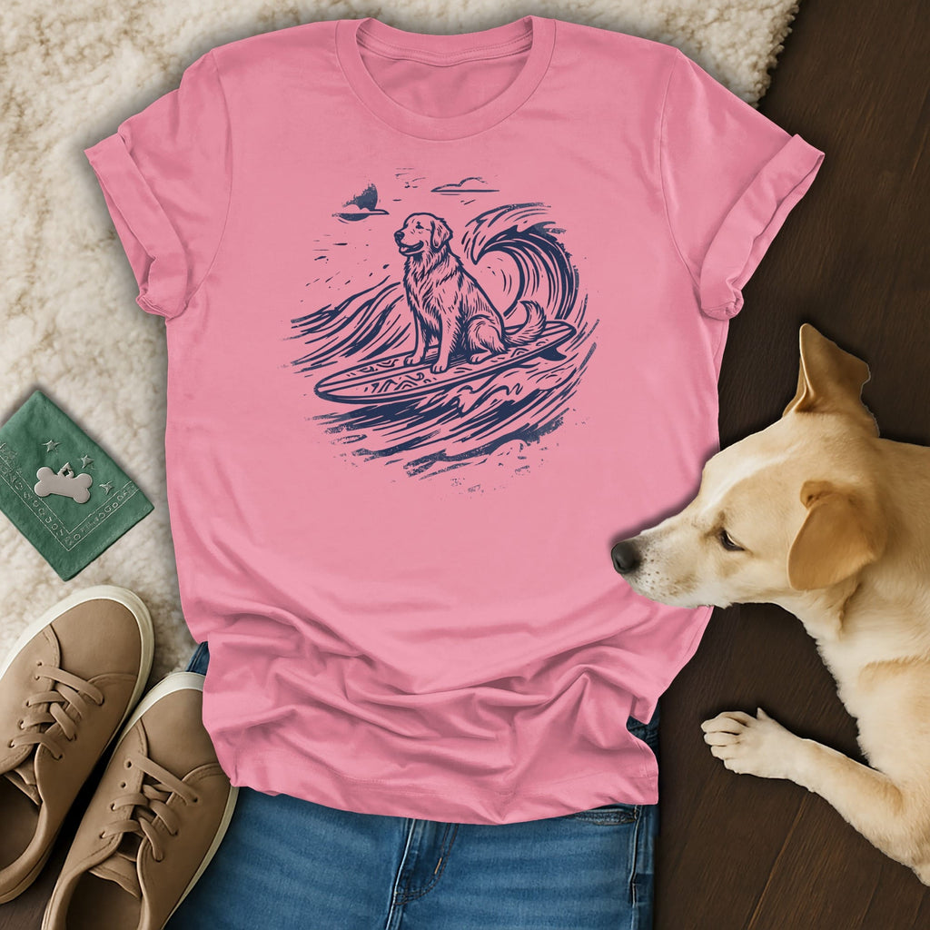Pink t-shirt with a golden retriever surfing a wave.