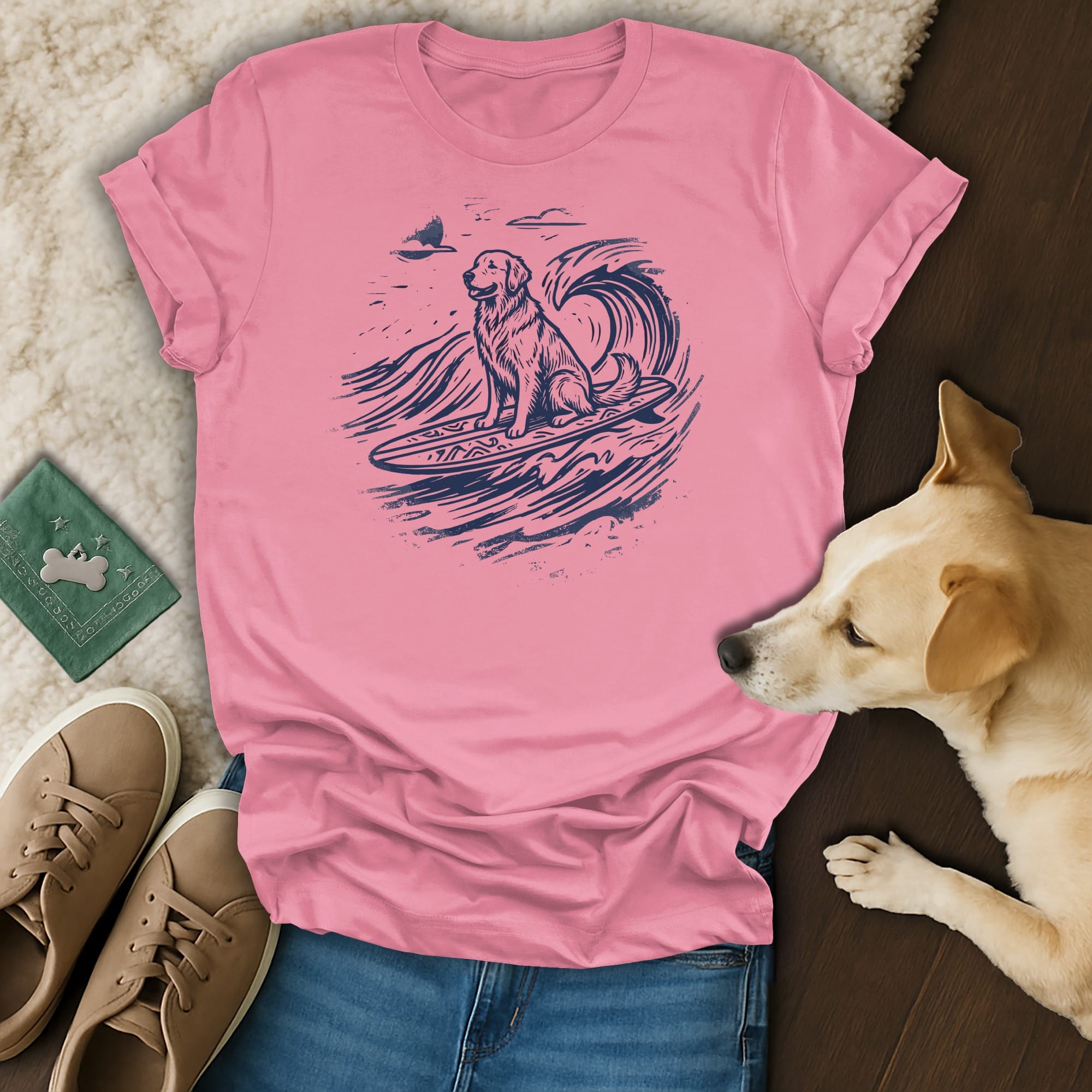Pink t-shirt with a golden retriever surfing a wave.