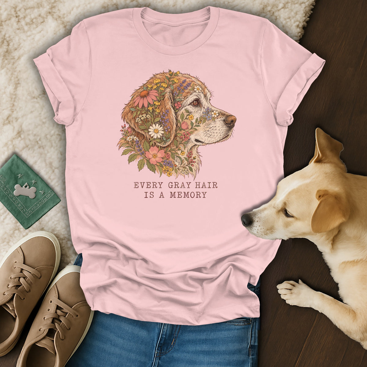 A pink t-shirt featuring a golden retriever graphic adorned with flowers and the text "EVERY GRAY HAIR IS A MEMORY".