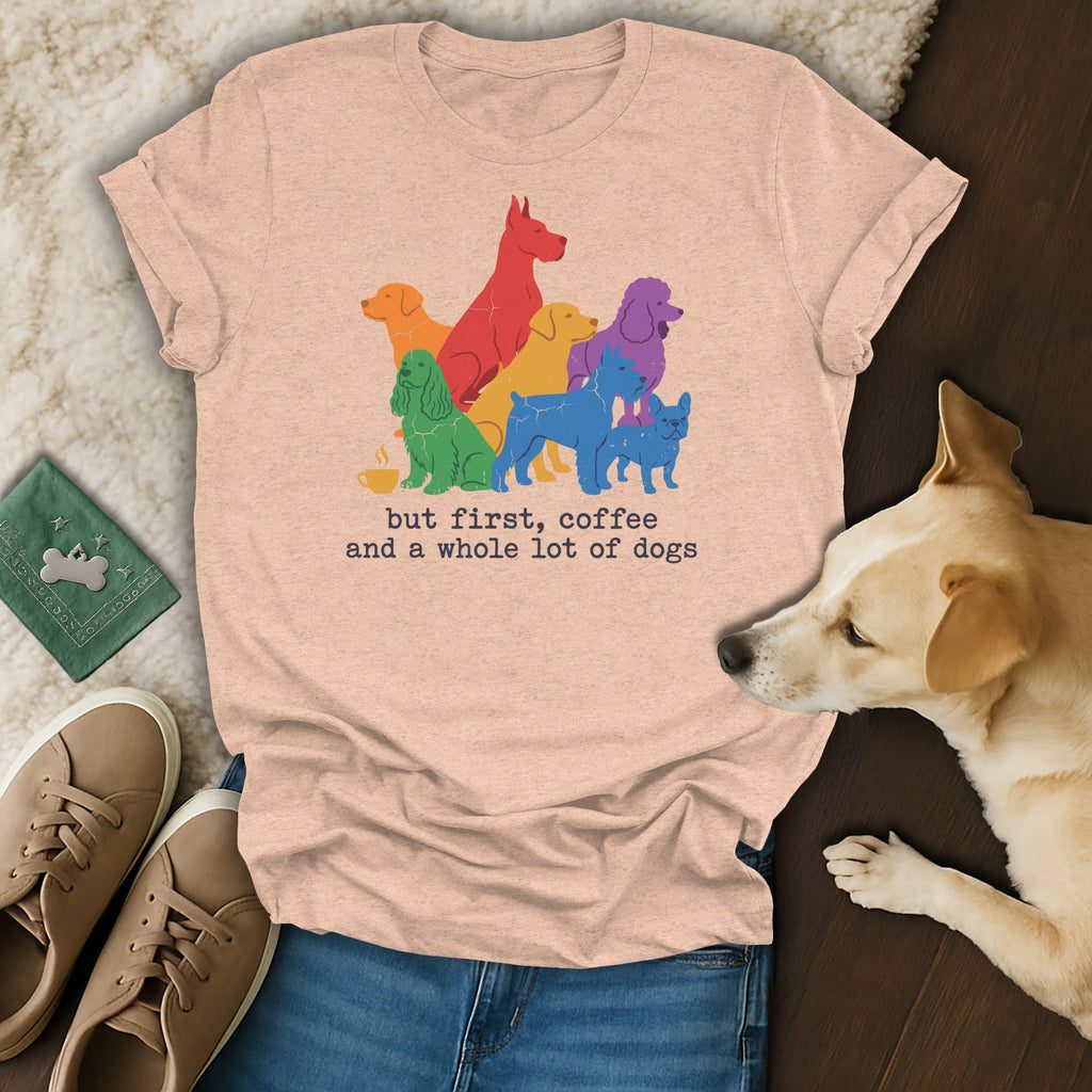 Peach t-shirt with colorful dogs and text "but first, coffee and a whole lot of dogs".