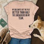 Peach t-shirt with "My dog sniffs out the play better than half the linebackers on my team." text.