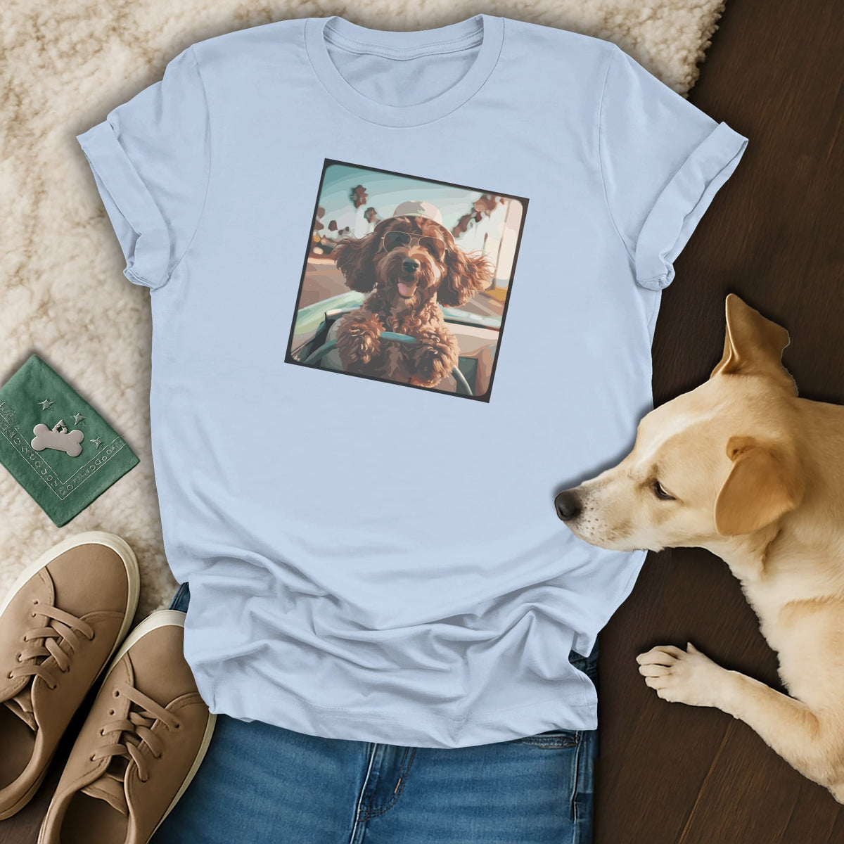 Light blue t-shirt featuring a dog wearing sunglasses in a convertible.