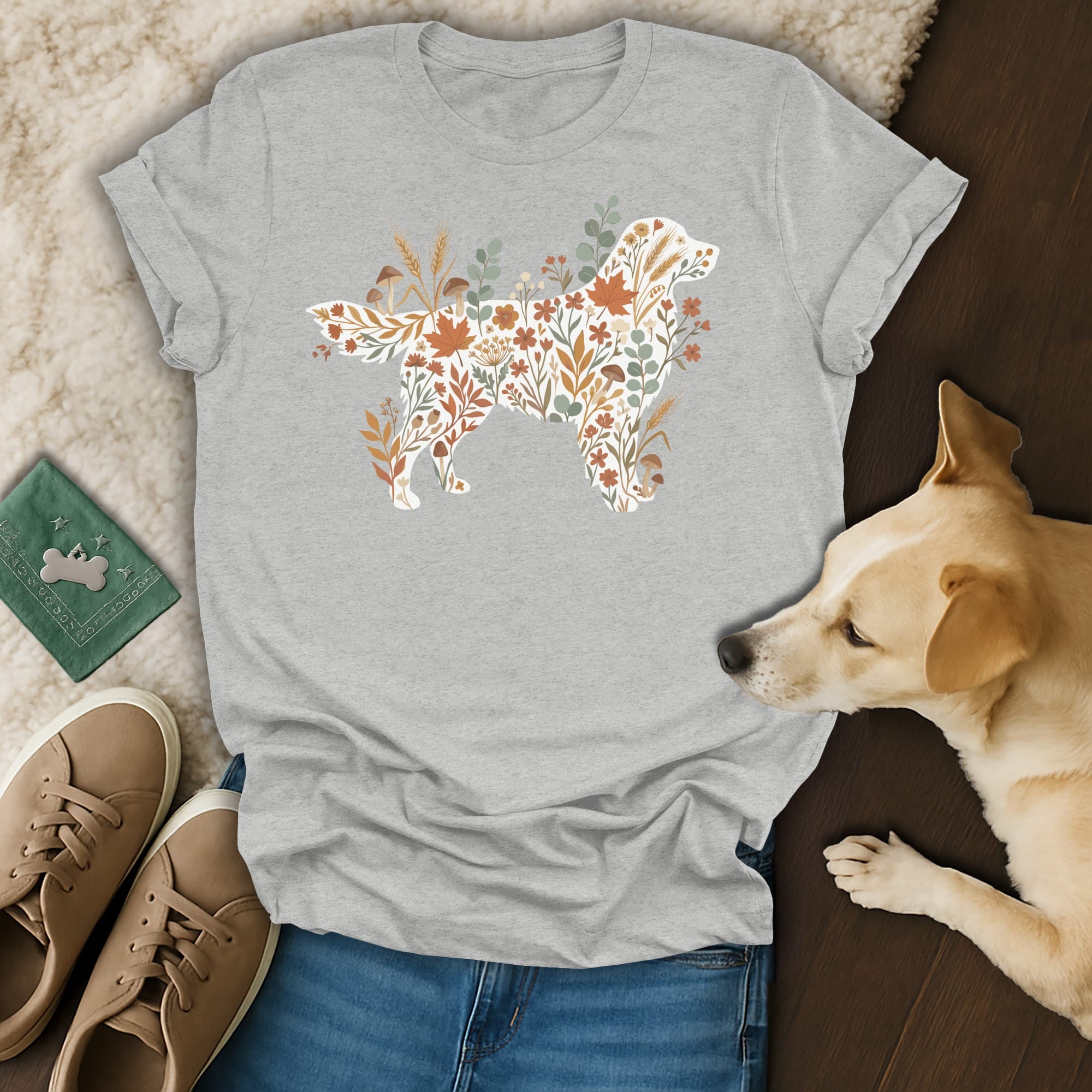 Gray t-shirt with a dog silhouette filled with autumn floral and mushroom illustrations.