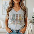 Grey t-shirt with three cartoon dogs and the text "I LIKE BIG MUTTS AND I CANNOT LIE".