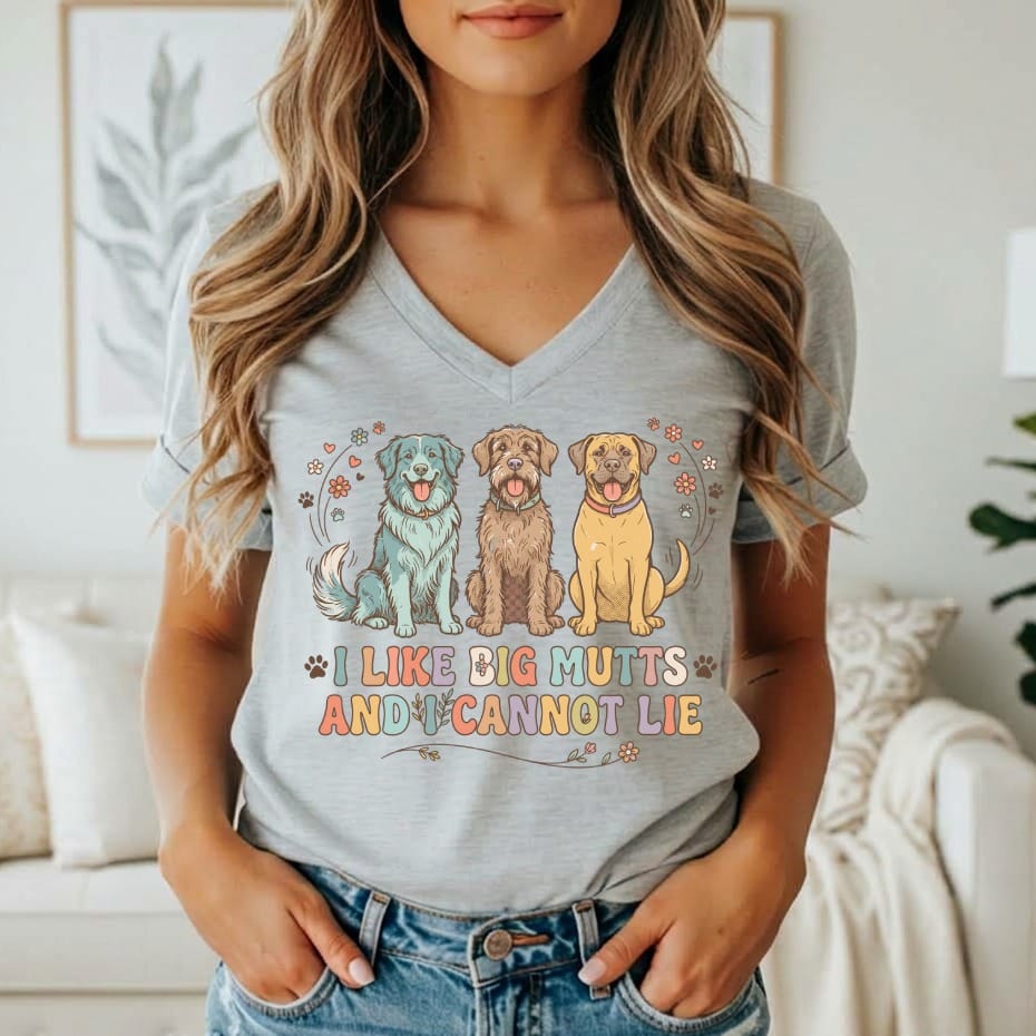 Grey t-shirt with three cartoon dogs and the text "I LIKE BIG MUTTS AND I CANNOT LIE".