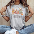 Grey t-shirt with illustration of four dogs and pumpkins, reading "Hap-Pup-ly Ever Autumn".