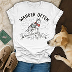 White t-shirt with "Wander Often" text and a husky on a mountain.