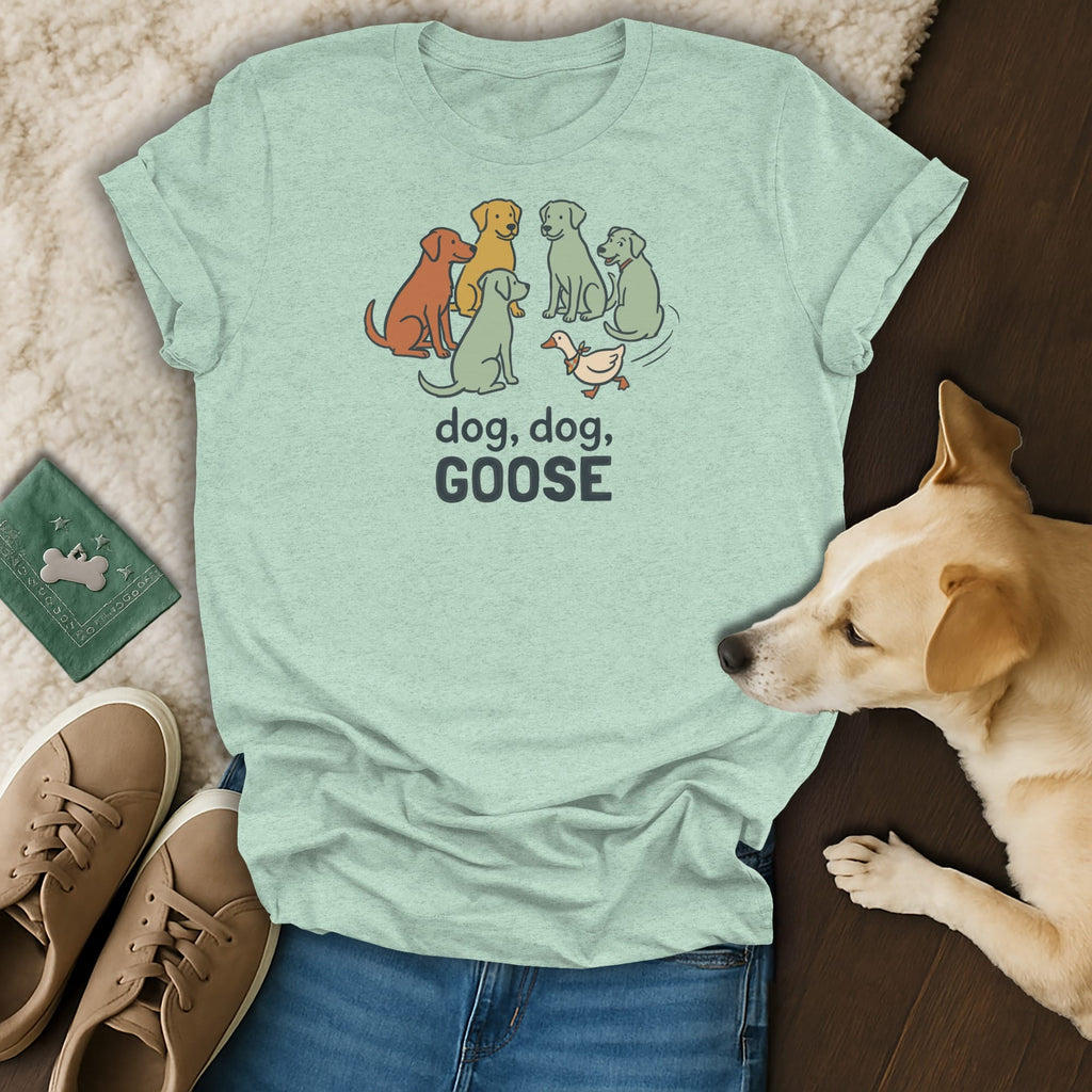 Light blue t-shirt with illustration of dogs and a goose, text "dog, dog, GOOSE".