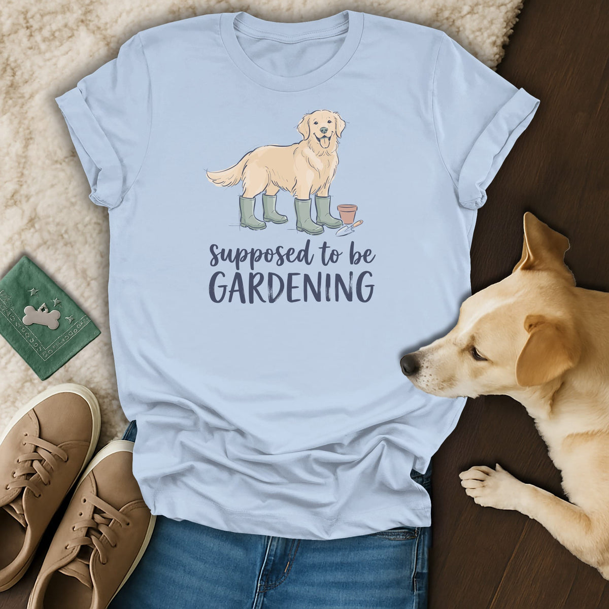 Light blue t-shirt with a golden retriever illustration and the text "Supposed to be GARDENING."