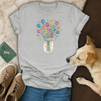 T-shirt with a watercolor bouquet of colorful paw prints in a mason jar.