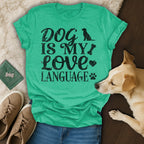 Green t-shirt with "Dog is My Love Language" text and dog paw graphic.