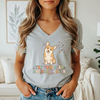 Grey v-neck t-shirt with a corgi illustration and text "TILT YOUR HEAD AND REALLY LISTEN."