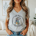 Gray t-shirt with a colorful dog wearing a bandana and bag, with text "old dog, new trips".