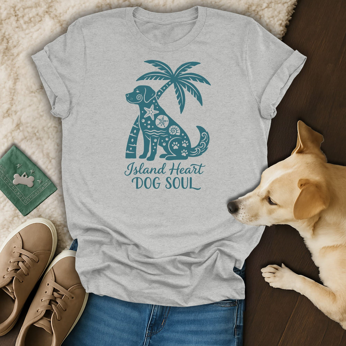 Light gray t-shirt with teal dog and palm tree graphic and text.
