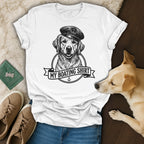 White t-shirt with a drawing of a golden retriever in a sailor hat.