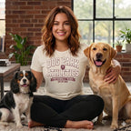 Woman in t-shirt with "Dog Park Athletics Professionally Trained (By My Dog)" text with two dogs.